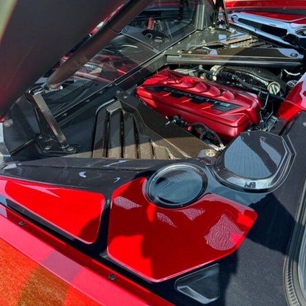Close up image of 2020+C8 Corvette Engine Fender Covers by Classic Trim Customs. The base color is Carbon Flash with accents in tord red. These are available in any corvette color combination