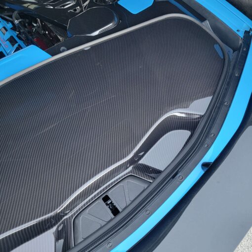 hydrocarbon fiber Corvette C8 trunk cover by classic trim customs on a rapid blue corvette